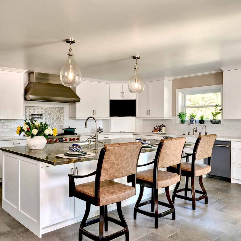 Effective kitchen design prioritizes functional layouts over aesthetics, focusing on workflow, storage, appliance placement, circulation, and custom cabinetry to create practical, family-friendly spaces.